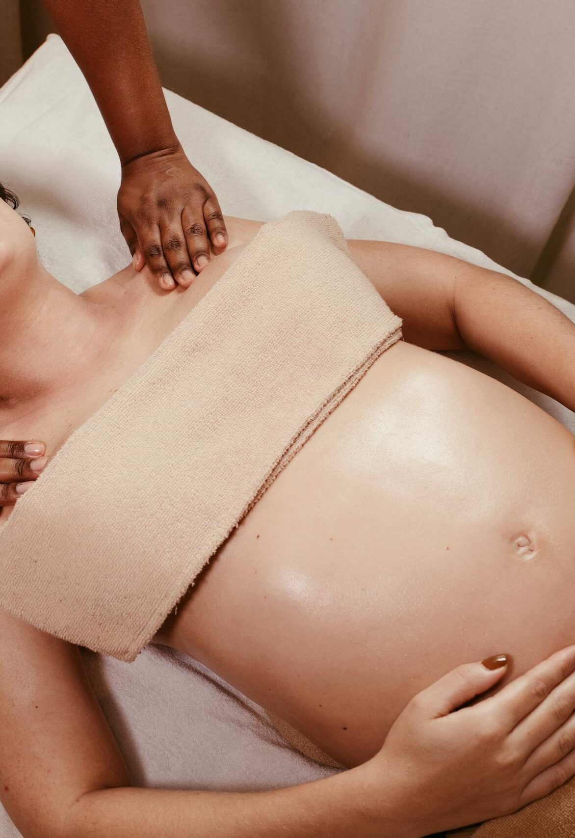 Pregnant woman enjoying a soothing prenatal massage in a spa. Relaxation and pampering at its best.